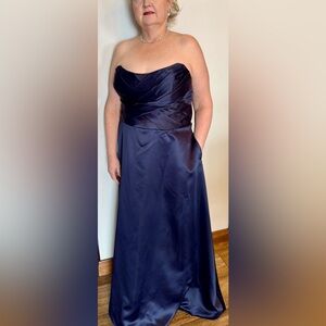 Morilee navy satin a-line bridesmaid dress with pleated bodice.   

Sku 21654